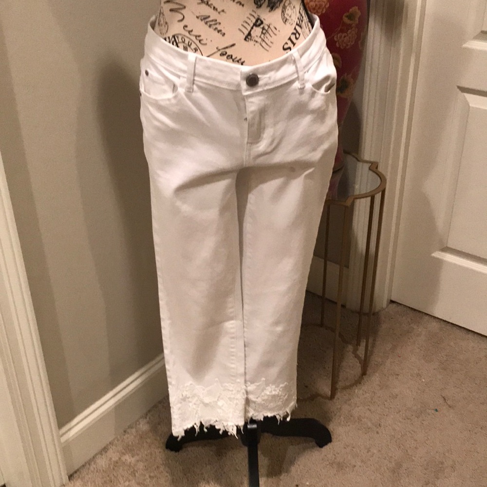 Simply Vera white jeans with appliqués on bottom.